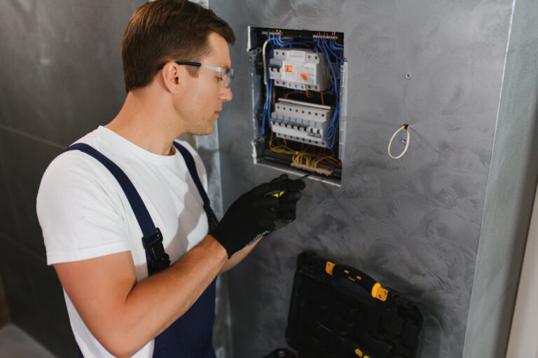 A professional electrician upgrading a residential electrical panel.