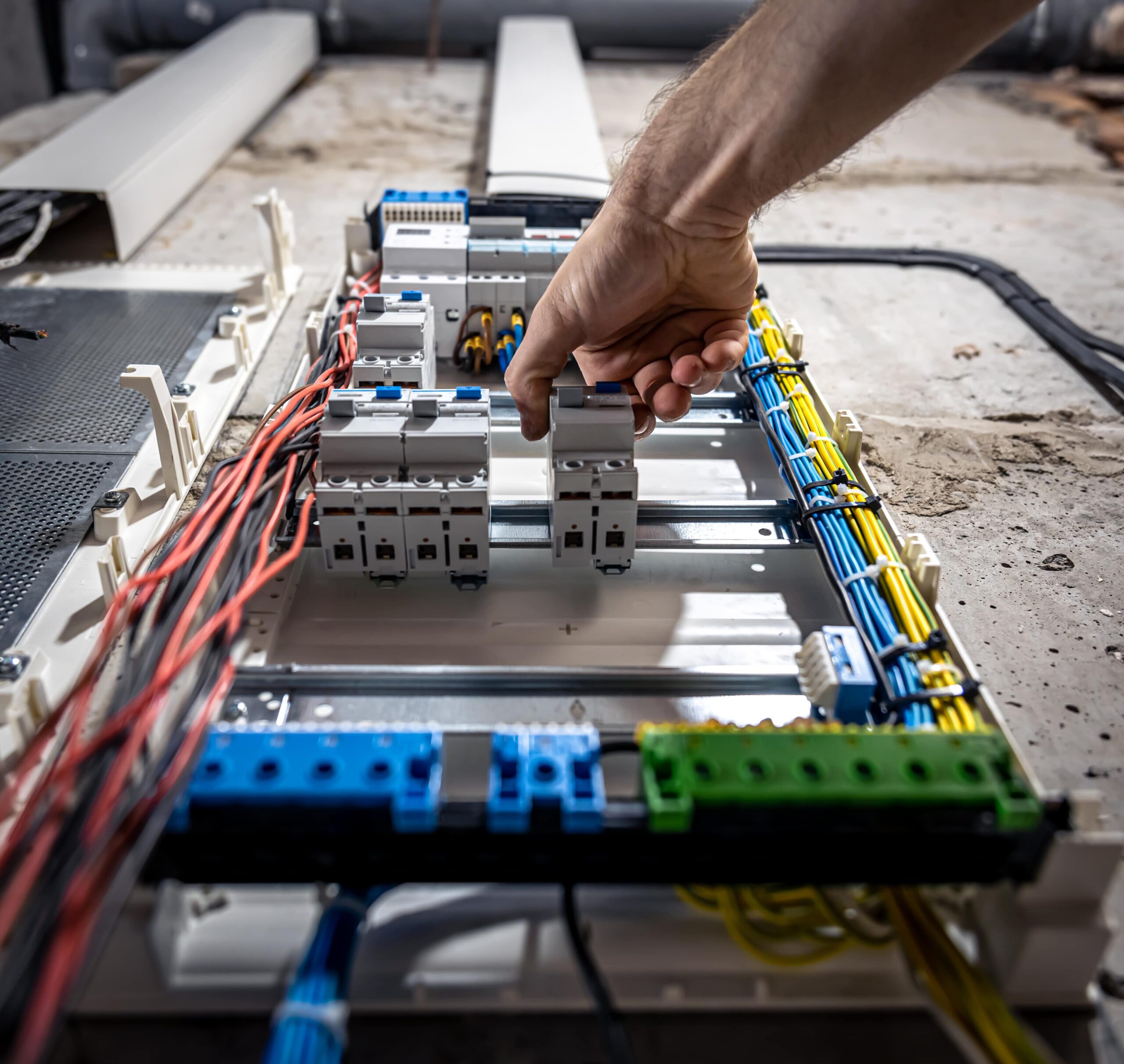 electrician working in a switch board