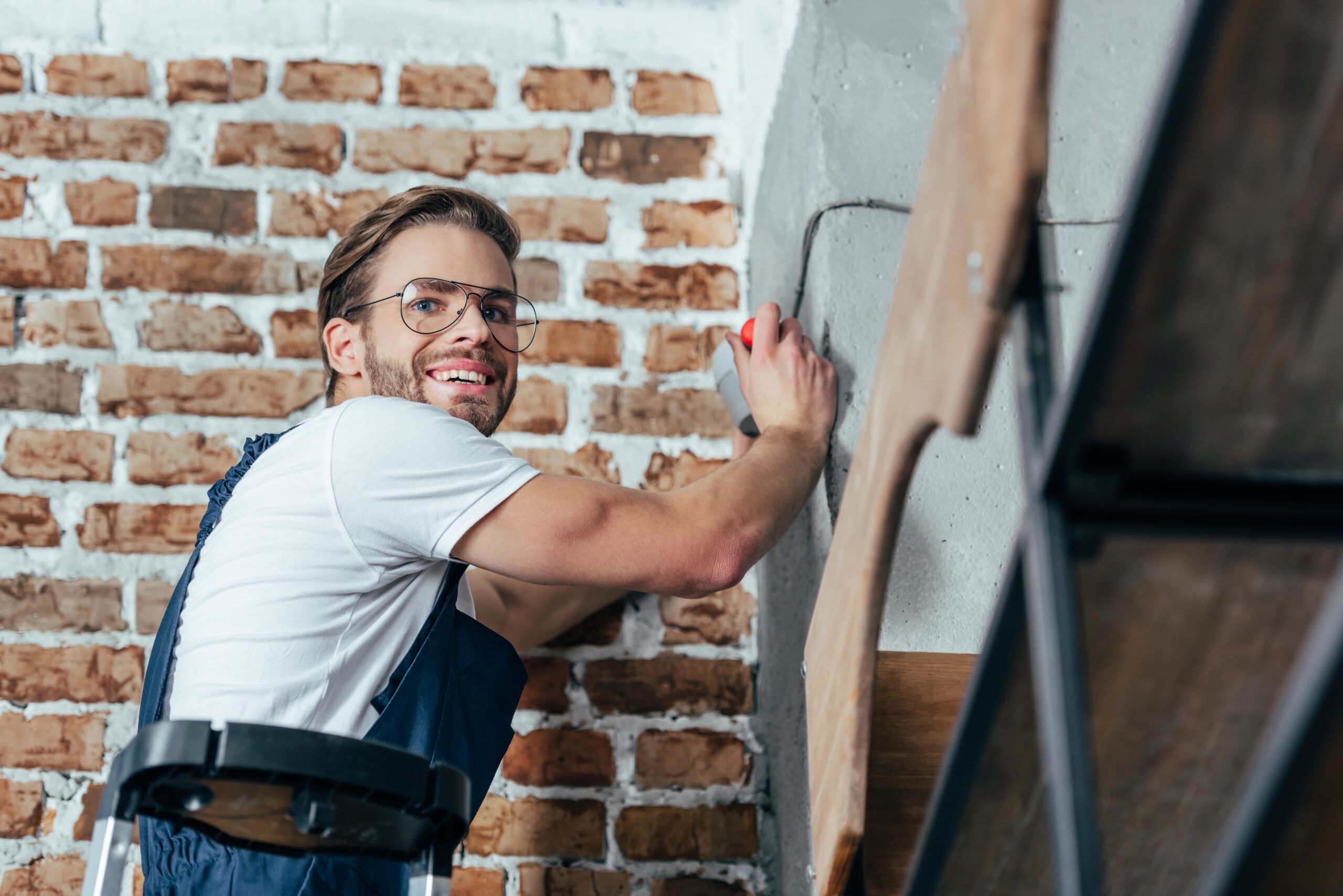 Young electrician smiling