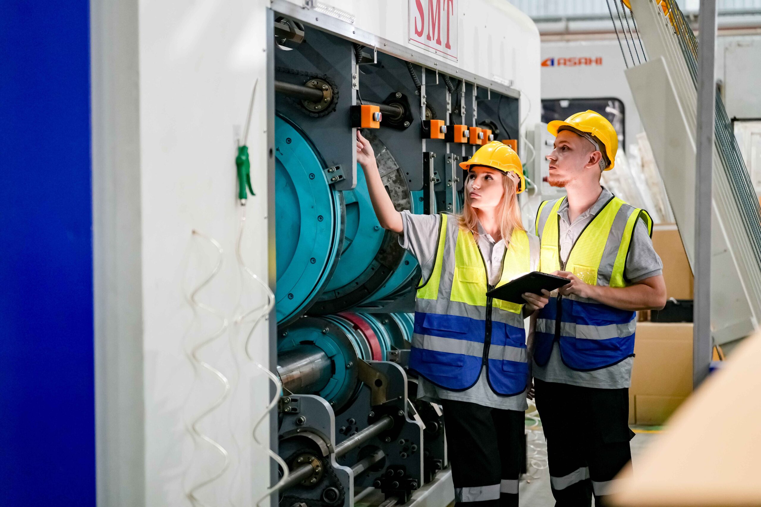 2 electrical technicians checking the generator machine