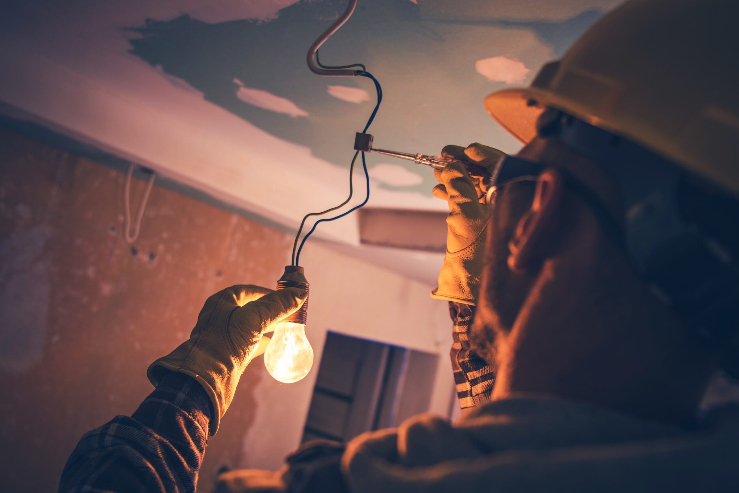 electrician fixing light wiring